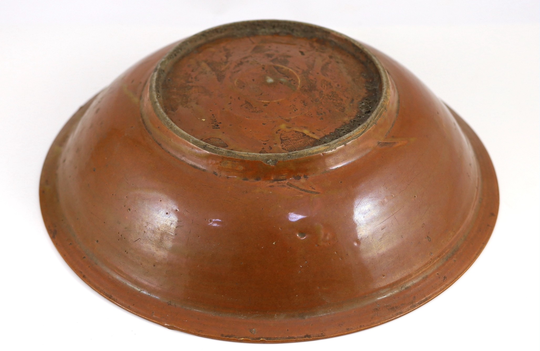 A Chinese Swatow slip-decorated brown ground dish, Zhangzhou kilns, early 17th century, 37cm diameter